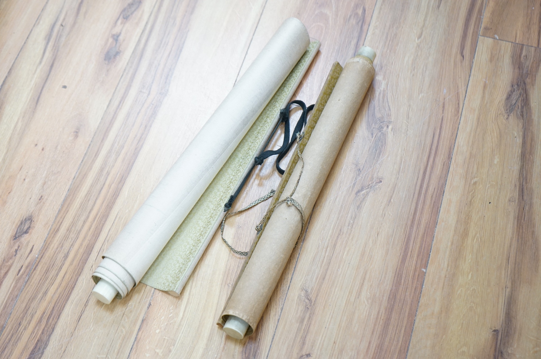 Two early 20th century Chinese embroidered silk scrolls to include one depicting flowers. Condition - fair/good